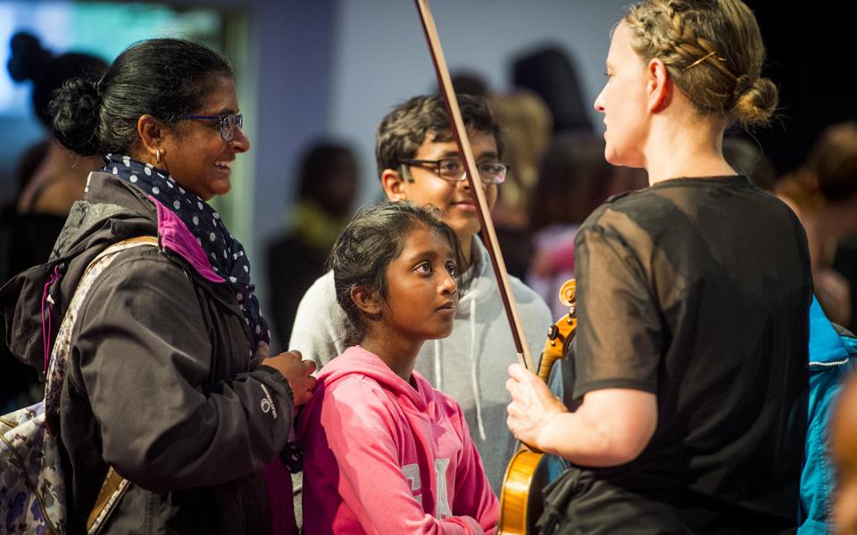 Emily Davis, second violin, meeting audience after family concert