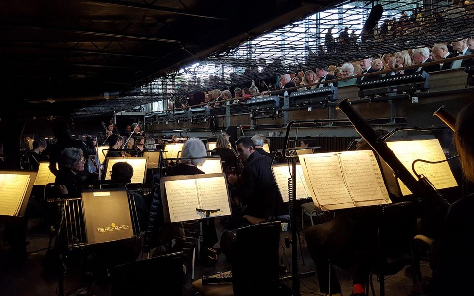 View from the pit of Garsington Opera, orchestra in the foreground, audience in the back