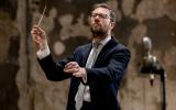 John Wilson conducting on stage