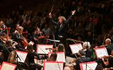 Santtu conducts the Philharmonia, both arms raised, at the Season Opening concert of our 2025/26 season
